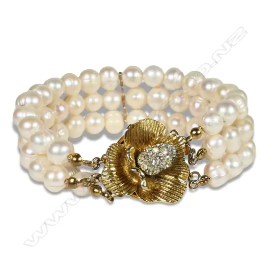 A triple strand pearl bracelet,
