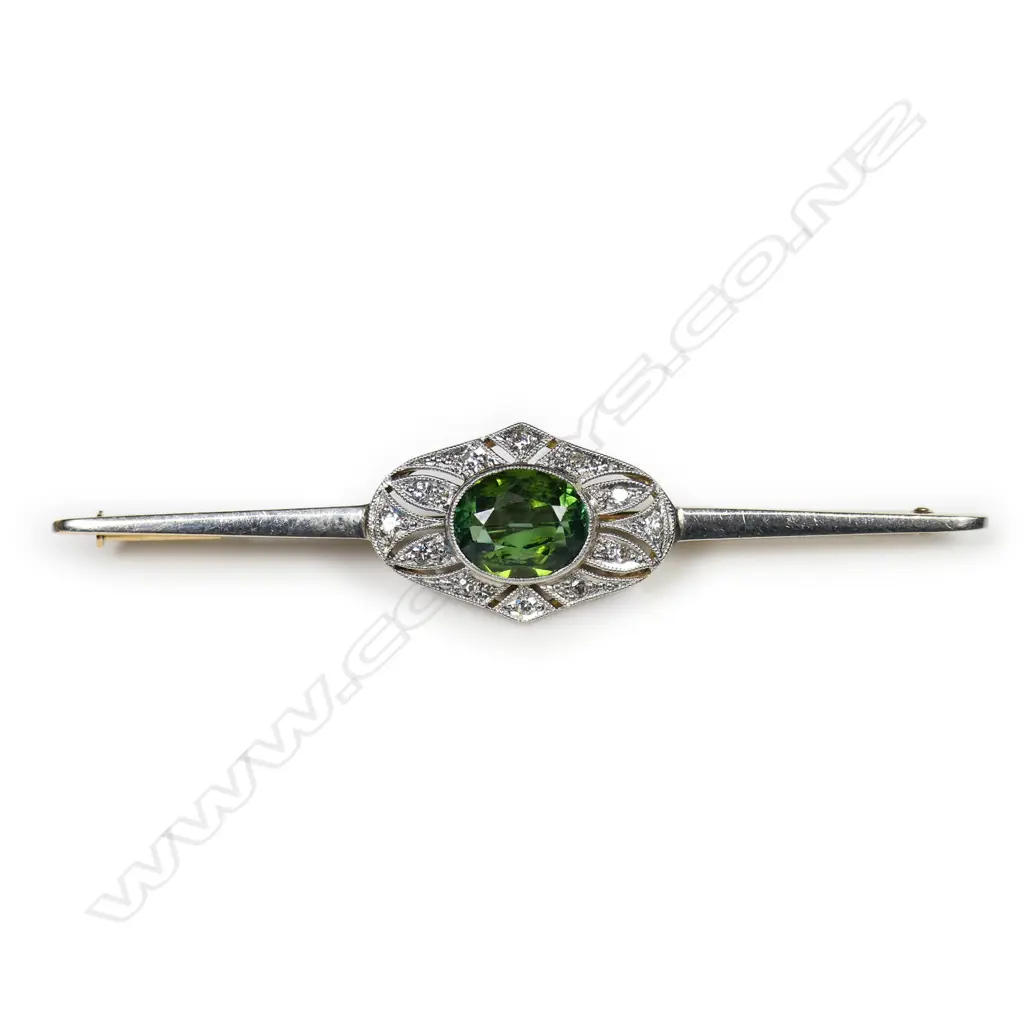 An 18ct gold and platinum Art Deco diamond and tourmaline bar brooch, Image 1++