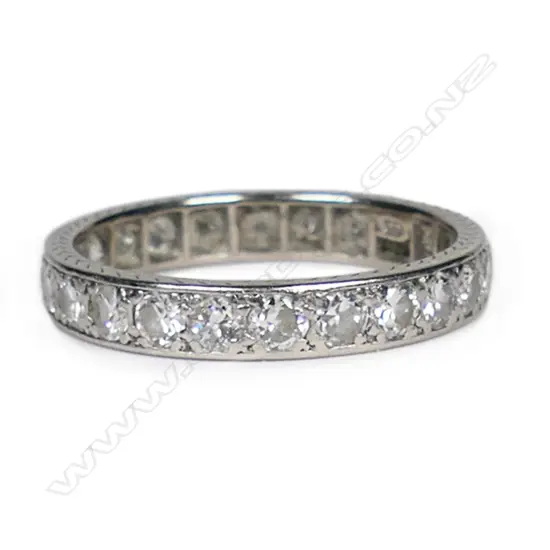 A quality early 20thC platinum and diamond eternity band,