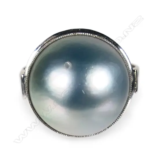 A14ct white gold and large silver blue tone mabe pearl ring,