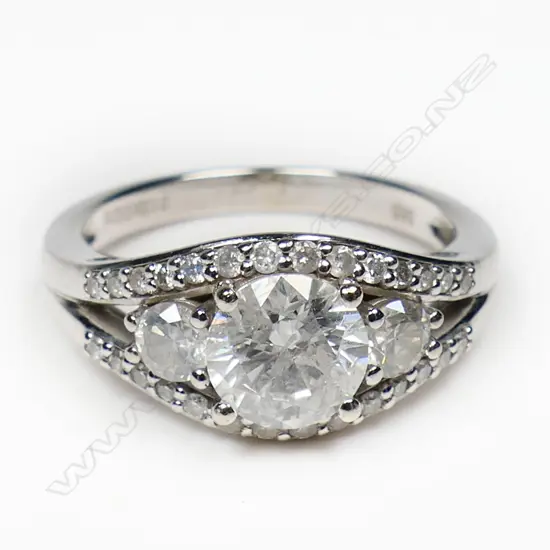 A 14ct white gold and diamond trilogy ring,