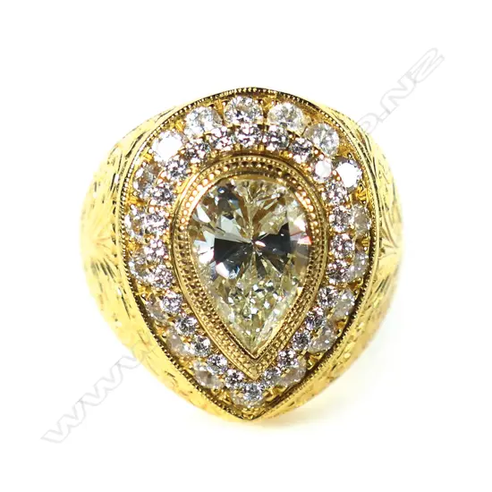 A large 18ct yellow gold yellow pear cut diamond and diamond cluster ring,