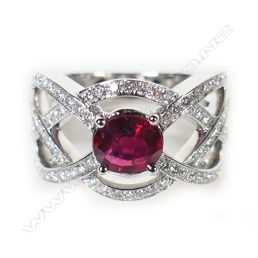 An 18ct white gold pigeon blood ruby and diamond ring, Image 1++