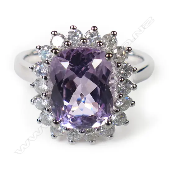 A 14ct white gold kunzite and diamond halo ring,
