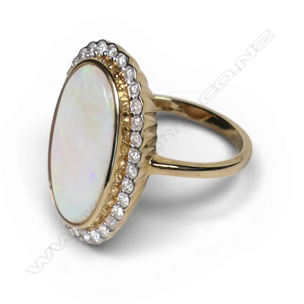 A 14ct gold opal and diamond ring, Image 1++