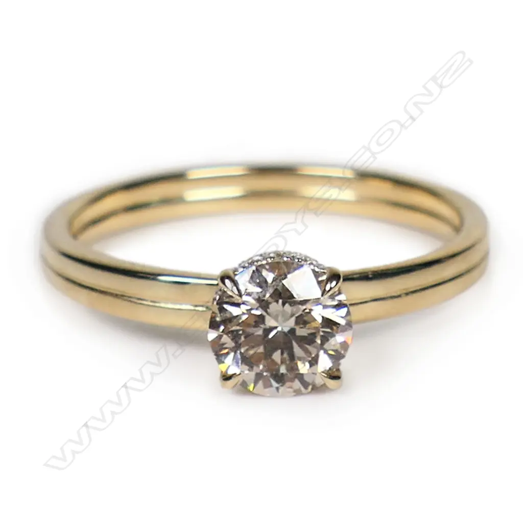 A 14ct gold and diamond hidden halo ring, Image 1++