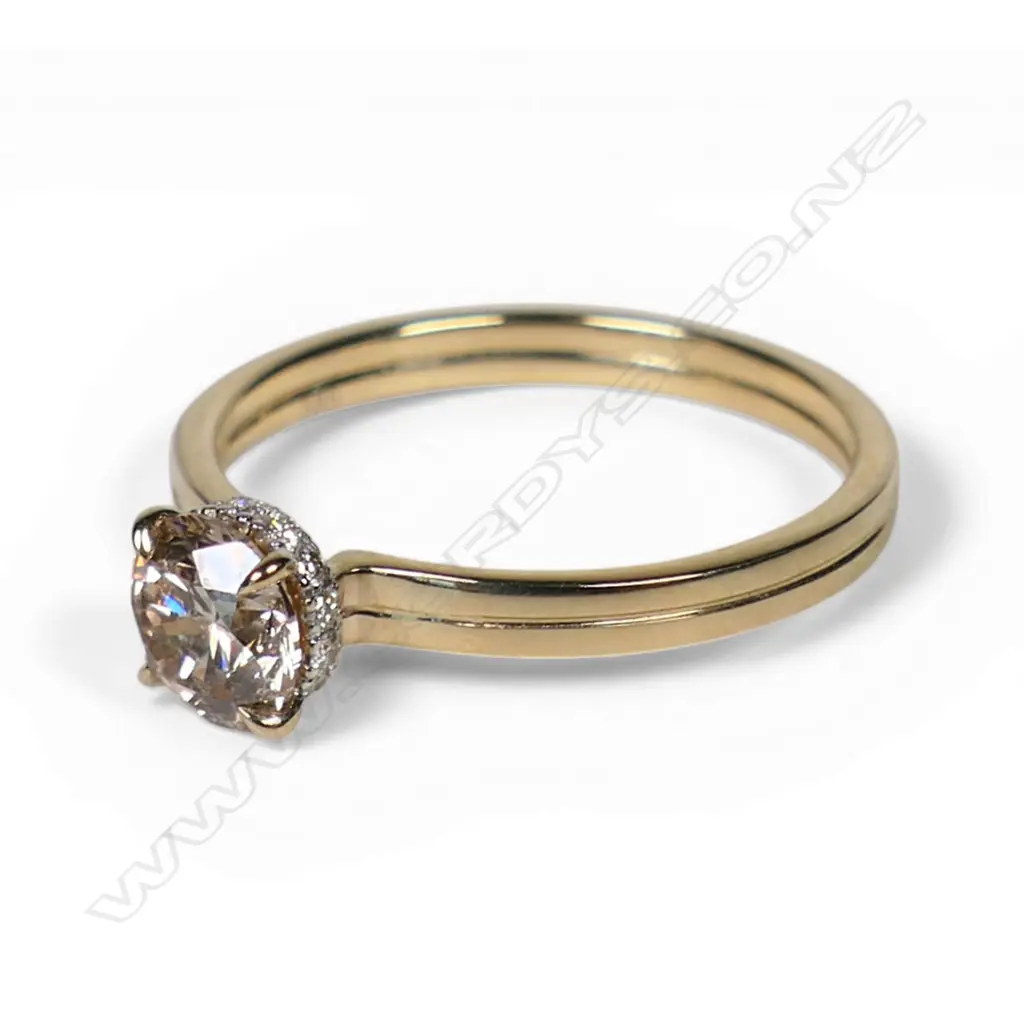 A 14ct gold and diamond hidden halo ring, Image 1++