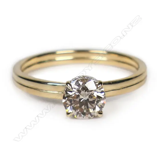A 14ct gold and diamond hidden halo ring,
