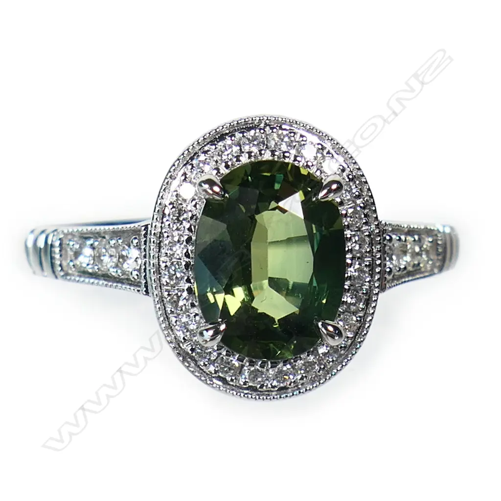 An 18ct white gold green sapphire and diamond ring, Image 1++
