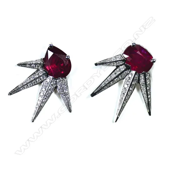A pair of dramatic 18ct white gold ruby and diamond starburst earrings,