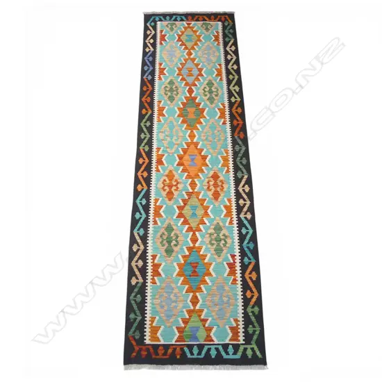 A hand-woven kilim runner,