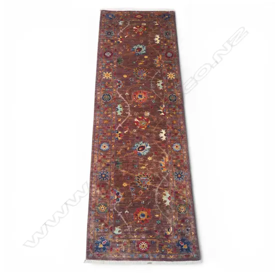 A hand-knotted Chobi runner,