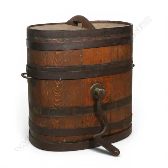 A Victorian coopered oak lidded butter churn with iron bound hoops,