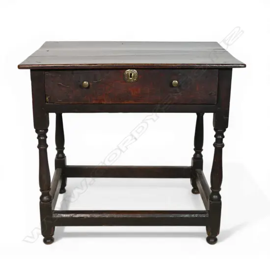 A George I/II country oak lowboy,
