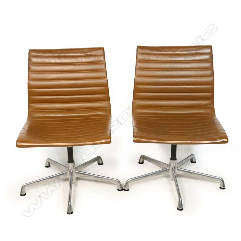 A pair of tan leather Eames conference swivel chairs, Image 1++