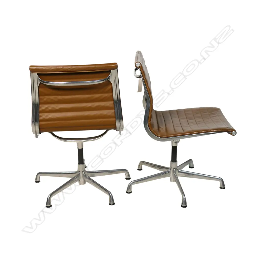 A pair of tan leather Eames conference swivel chairs, Image 1++