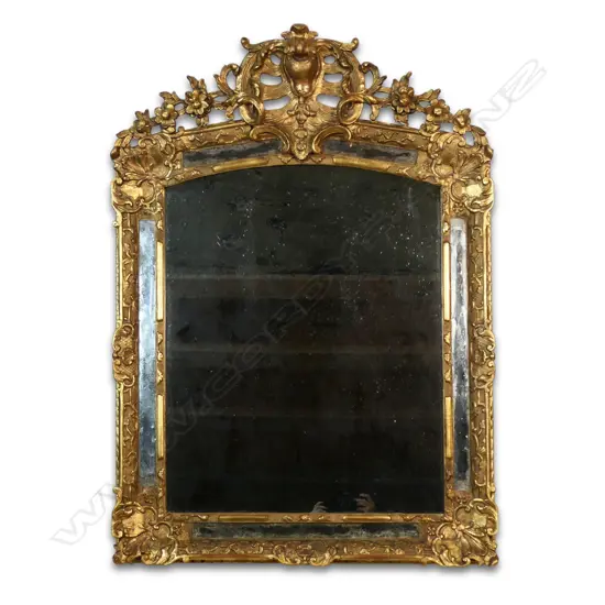 A 19thC cushion style mirror,