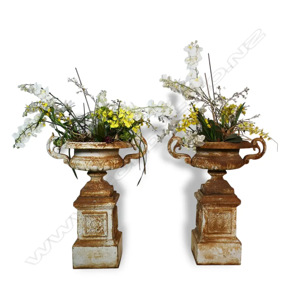 A pair of vintage cast iron garden urns on plinth bases, Image 1++