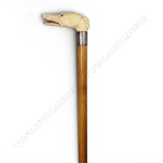 A quality carved ivory dog's head handled walking stick,