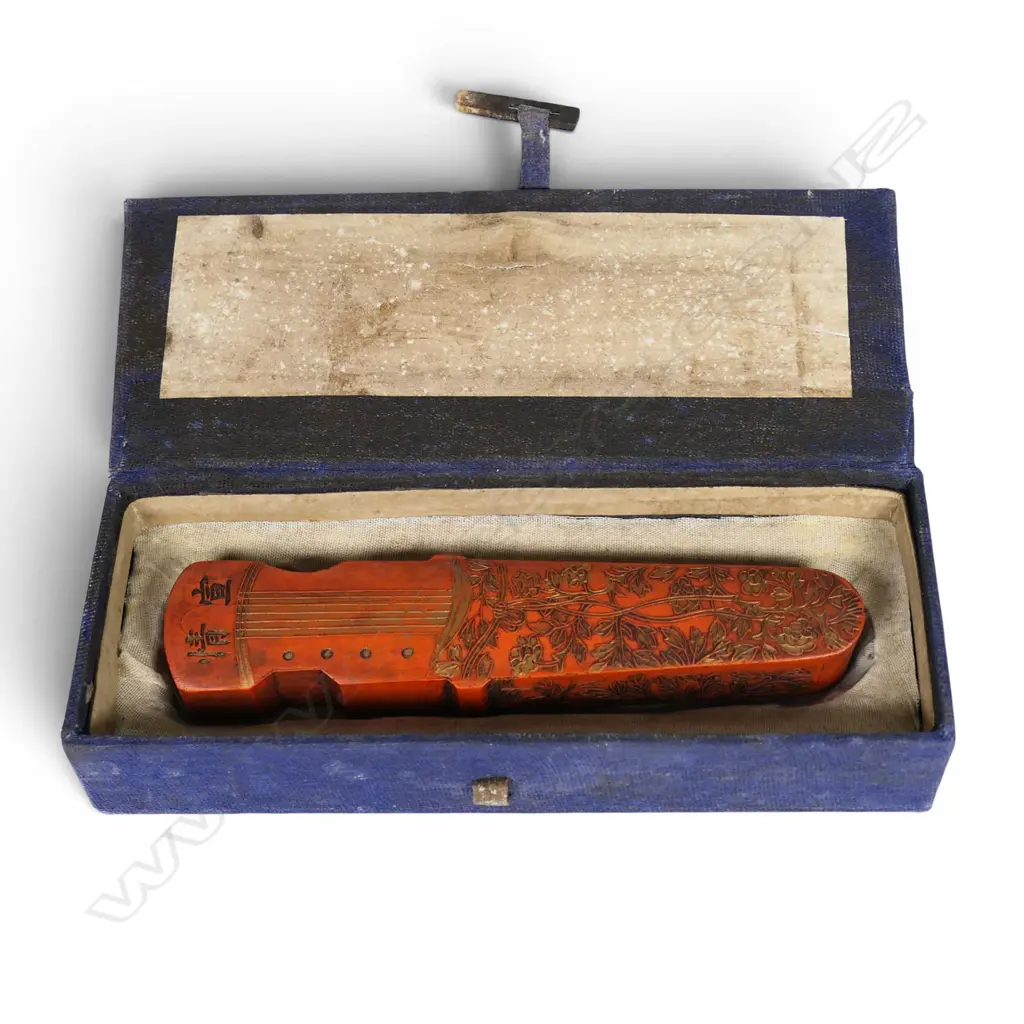 A Chinese red inkstone modelled as a guqin, Image 1++