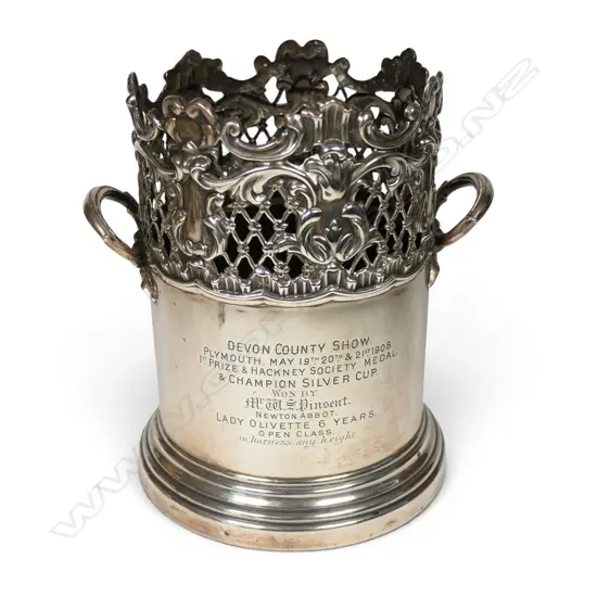 An Edwardian uncommon silver large bottle coaster,