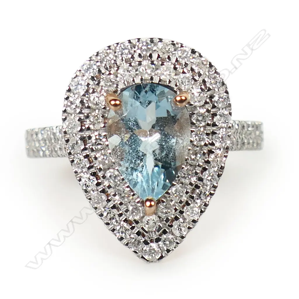 A 14ct rose gold aquamarine and diamond double halo ring, Image 1++