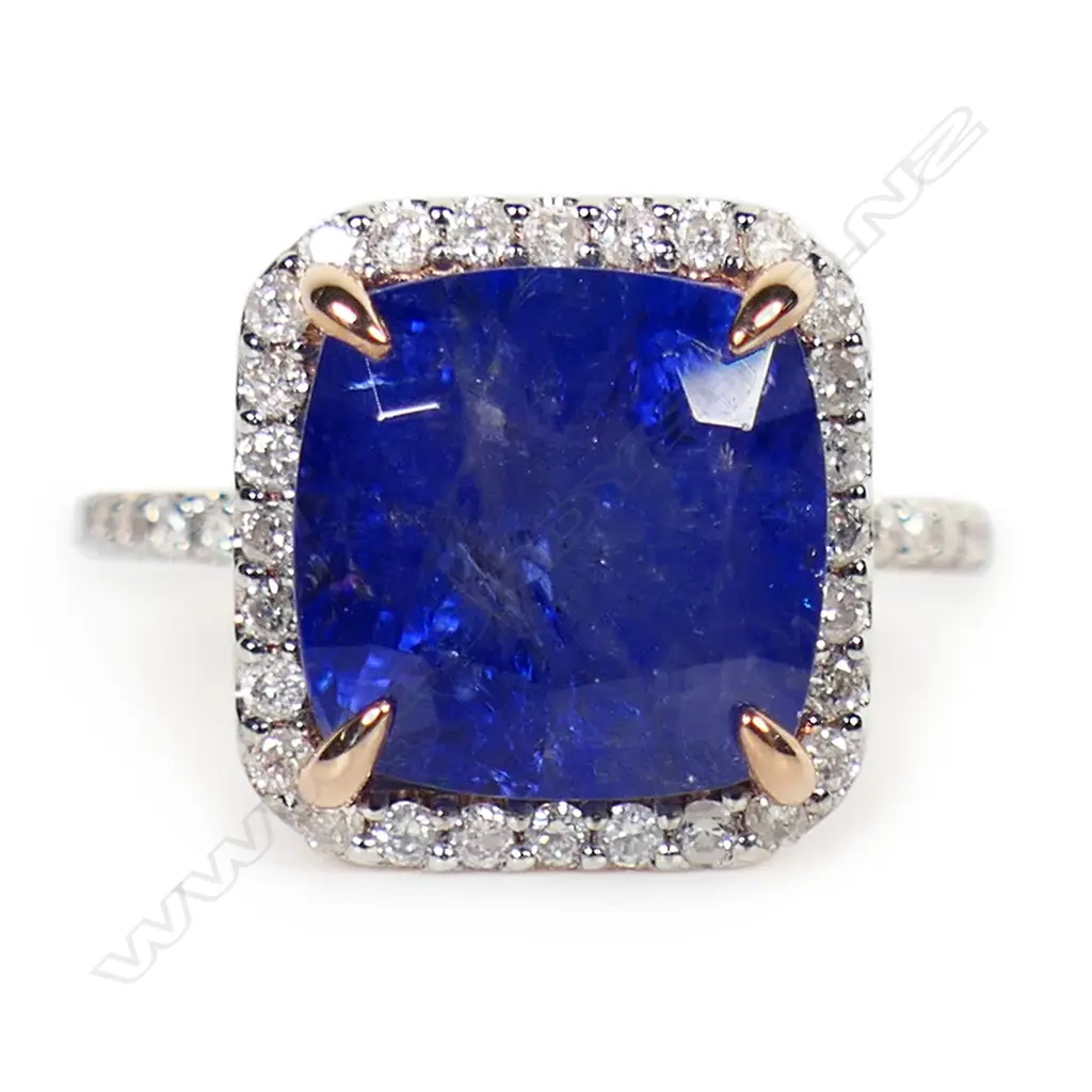 A 14ct rose gold tanzanite and diamond halo ring, Image 1++