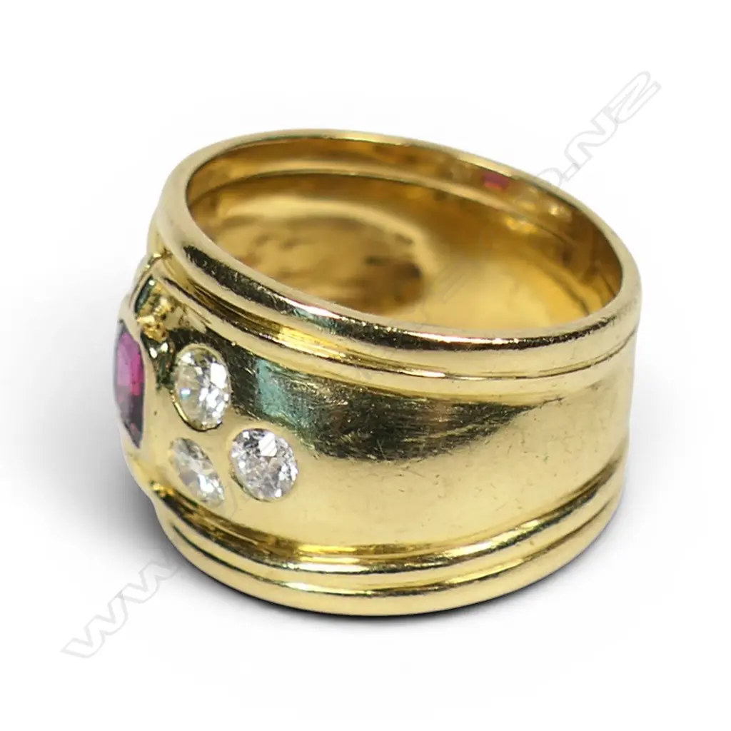 An 18ct gold diamond and ruby dress ring, Image 1++