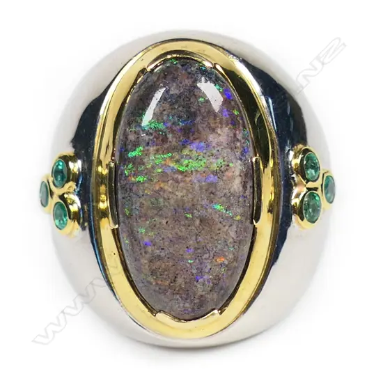 A large designer silver opal and emerald ring,