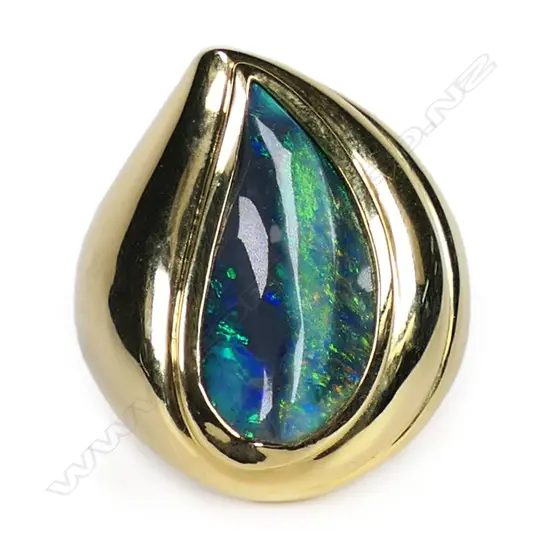 A large 18ct gold designer black opal ring,