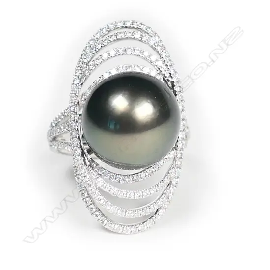 An 18ct white gold large black pearl and diamond ring,