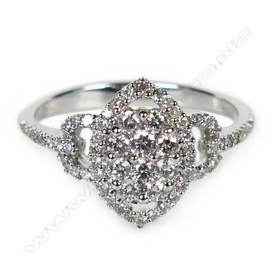 An 18ct white gold and diamond cluster ring,