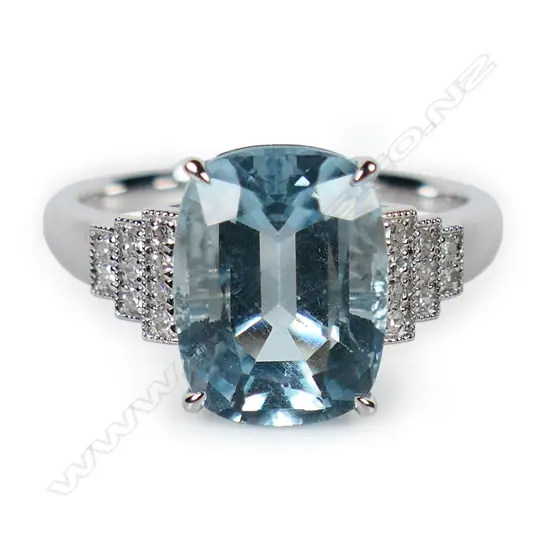 An 18ct white gold aquamarine and diamond Art Deco style ring,