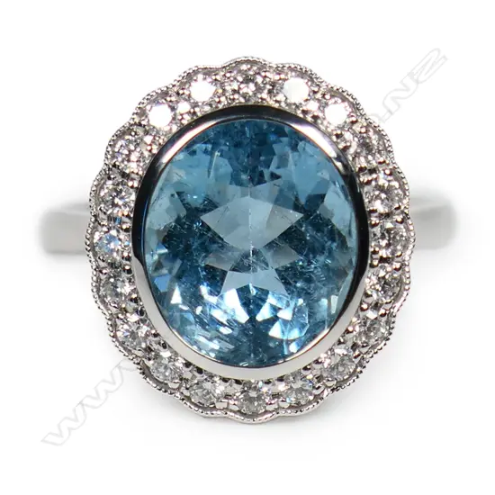An 18ct white gold aquamarine and diamond ring,