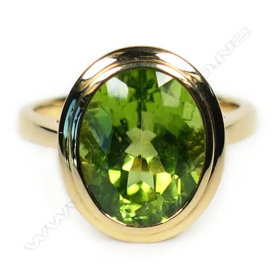 An 18ct gold and peridot ring,