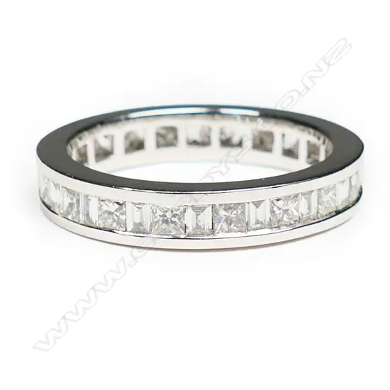 An 18ct white gold and diamond eternity band,