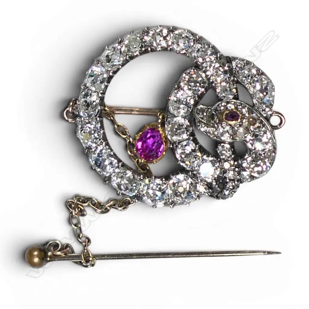 A Victorian 20ct and 9ct gold and silver diamond and pink sapphire snake brooch, Image 1++