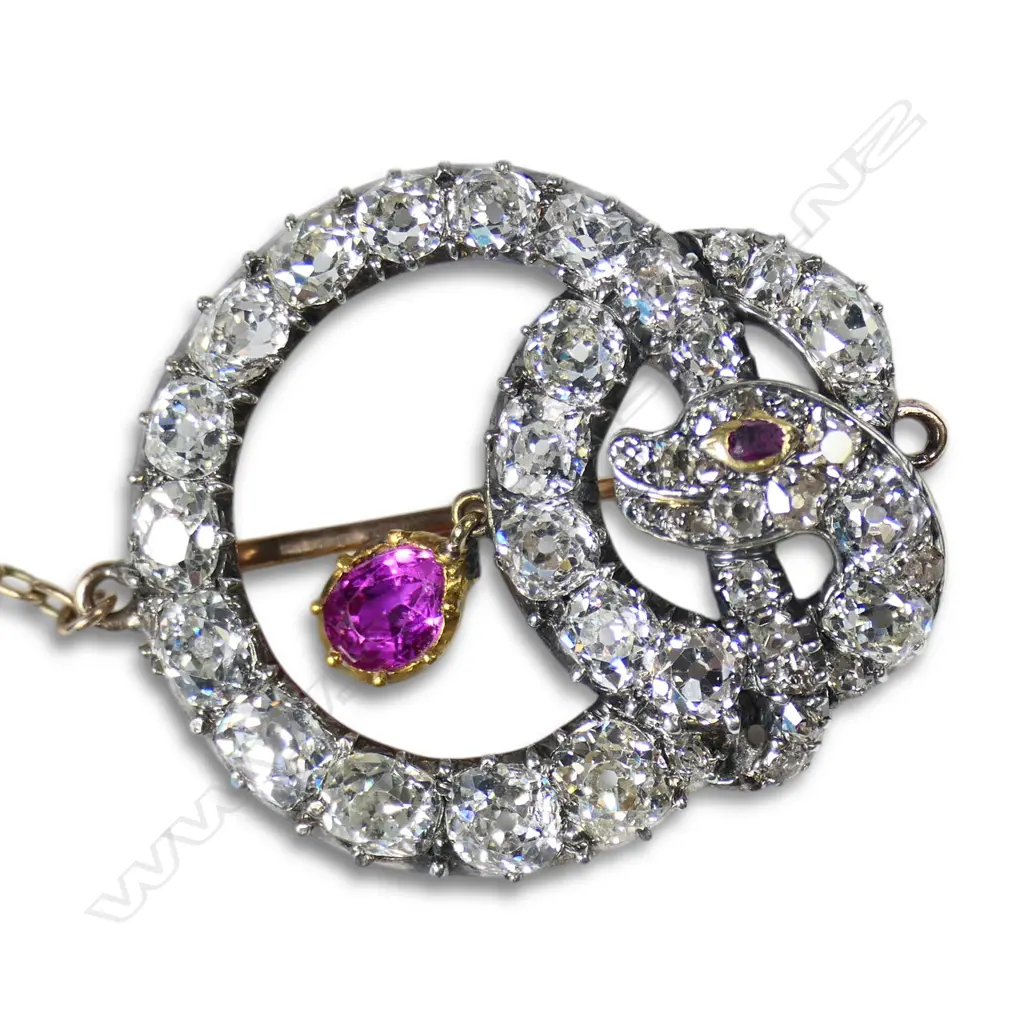 A Victorian 20ct and 9ct gold and silver diamond and pink sapphire snake brooch, Image 1++