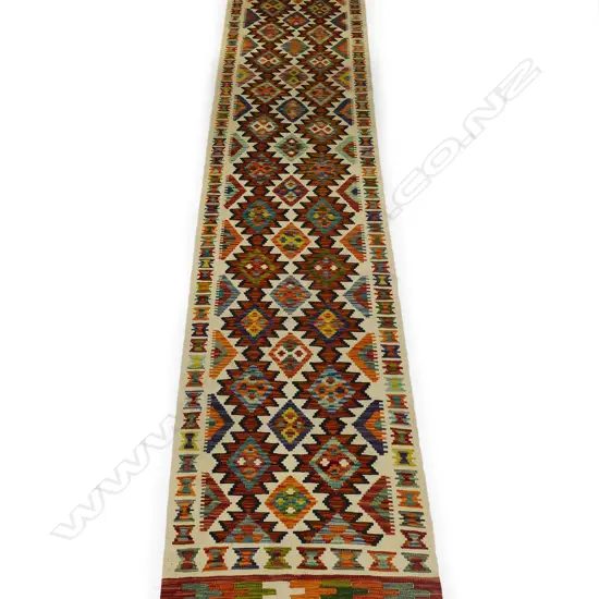A hand-woven kilim runner,