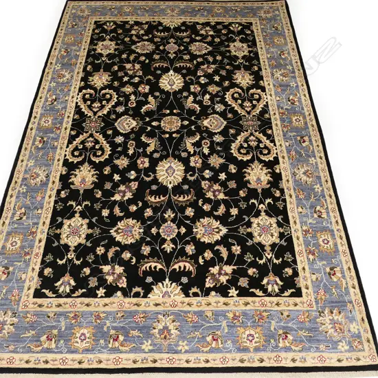 A quality hand-knotted Chobi carpet,