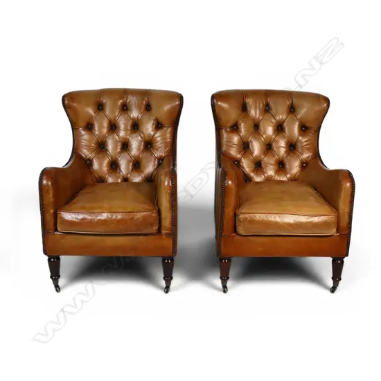 A pair of elegant antique style wingback leather armchairs,