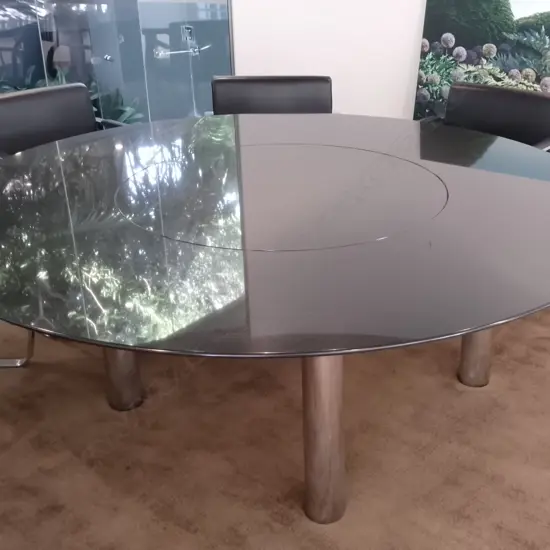 A modern designer circular granite dining table