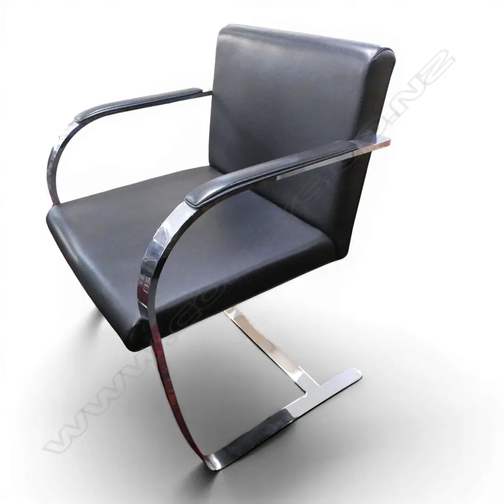 cantilevered steel flat bar design with black leather upholstery. Provenance: Purchased to match the previous lot Image 1++