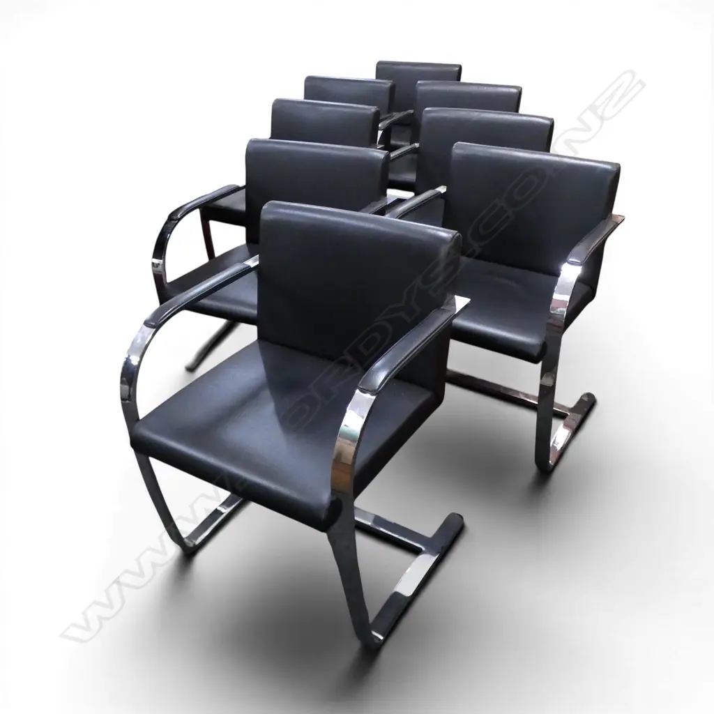 cantilevered steel flat bar design with black leather upholstery. Provenance: Purchased to match the previous lot Image 1++