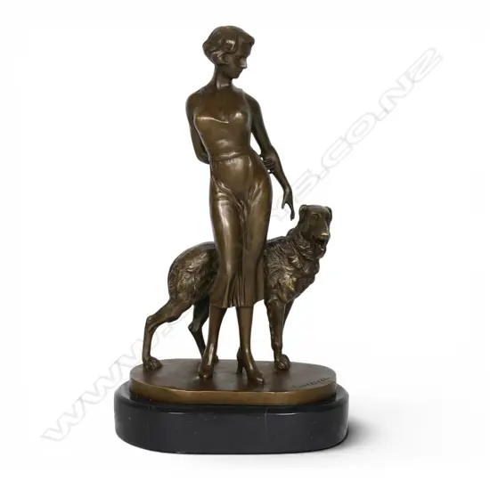 A modern Art Deco style bronze figurine of a standing woman with Borzoi hound,