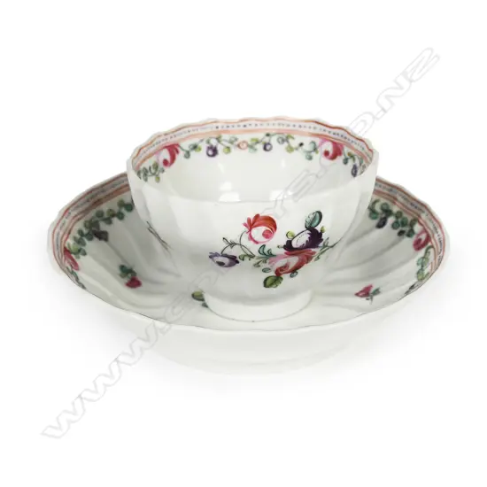 An 18thC New Hall porcelain tea bowl and saucer,