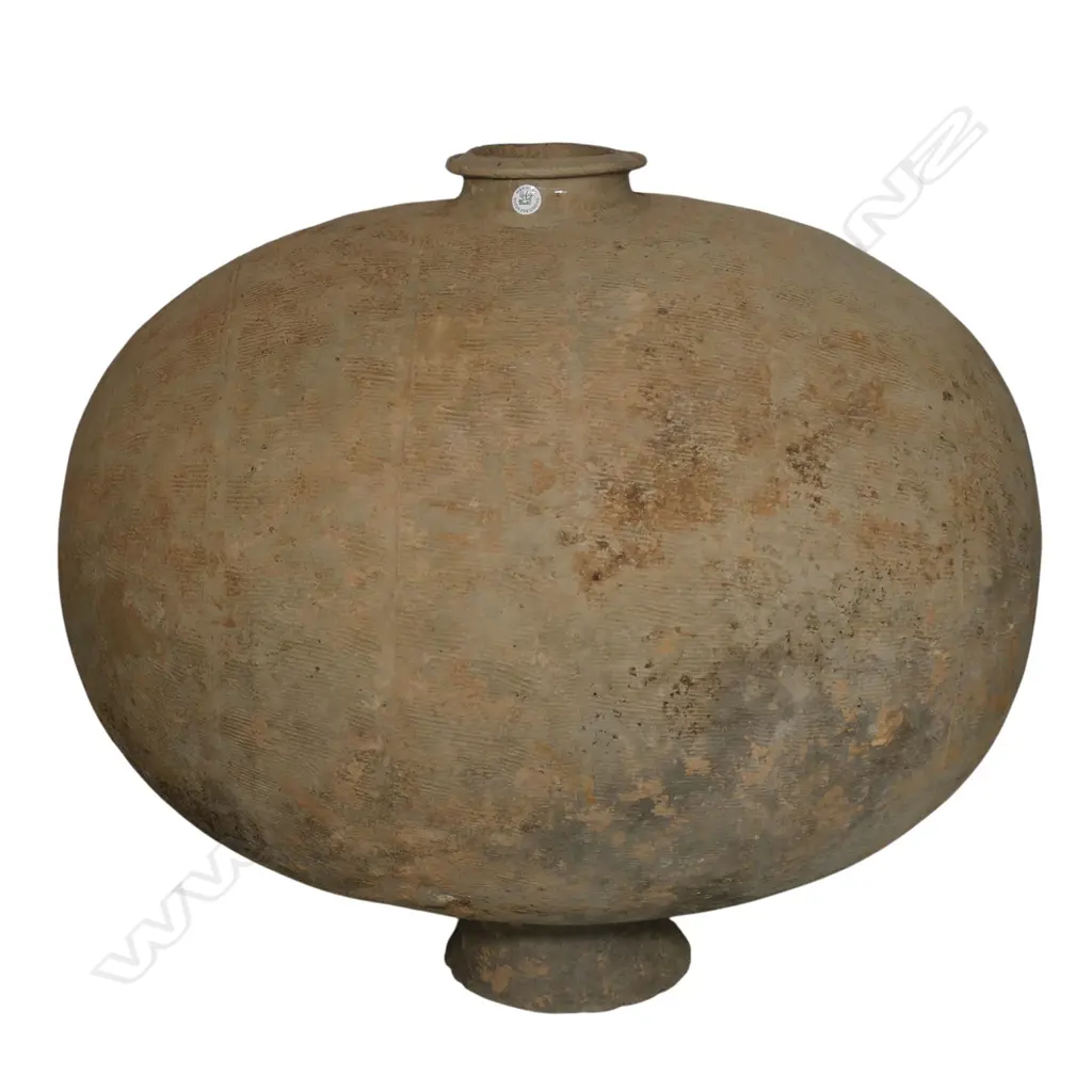 A reputedly rare and substantial Warring States Period (475-221 B.C) cocoon jar, Image 1++