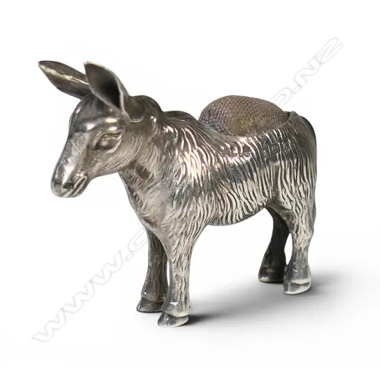 A rare Edwardian silver donkey pincushion,
