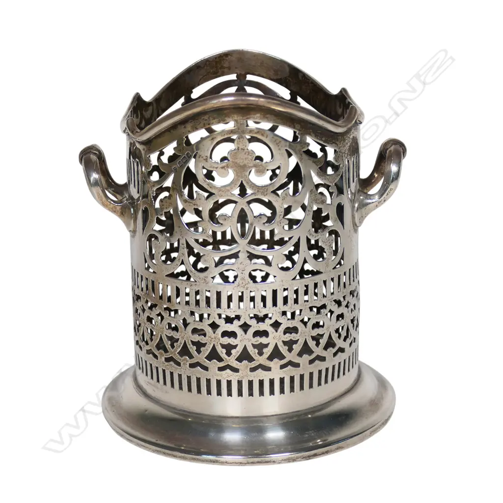 An early 1900s silver wine bottle holder, Image 1++