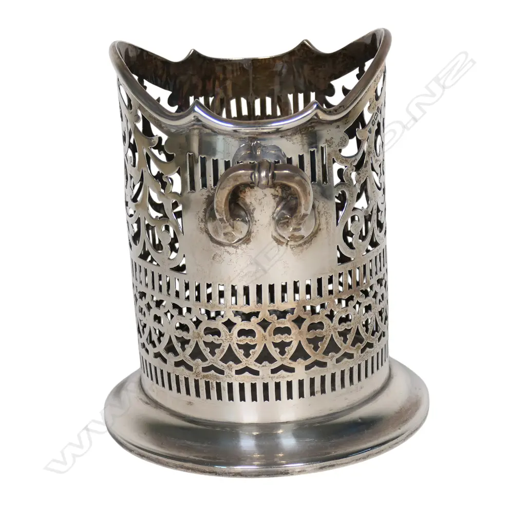An early 1900s silver wine bottle holder, Image 1++